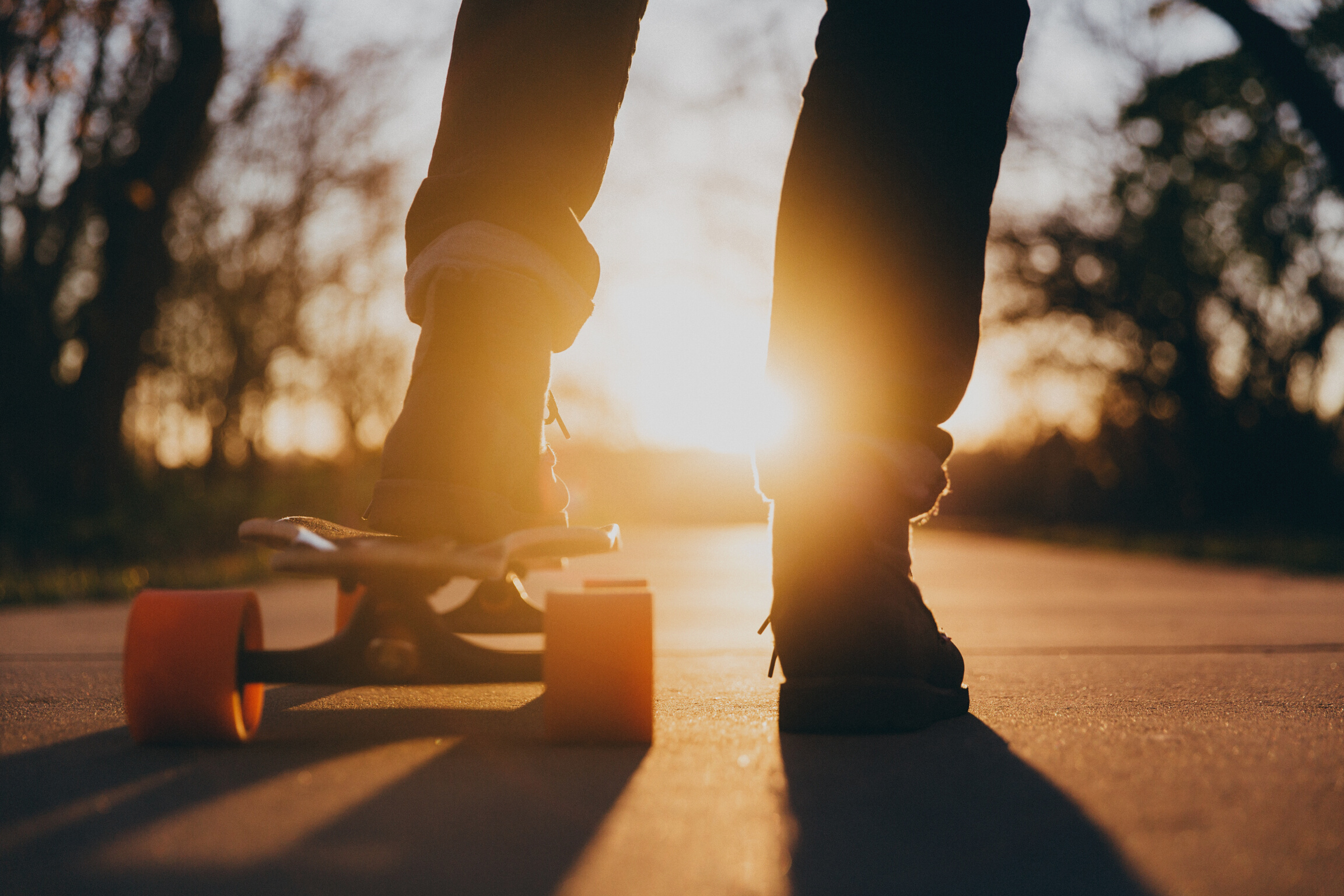 Skater Using Longboard at Sunset